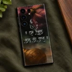 Jai Bajrangbali mobile skin with Hanuman outline, Hindi quote and golden gada - olive linen flatlay