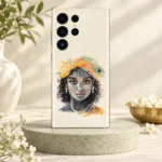 Kanha watercolour portrait mobile skin with orange turban and peacock feather on cream displayed on sage stone