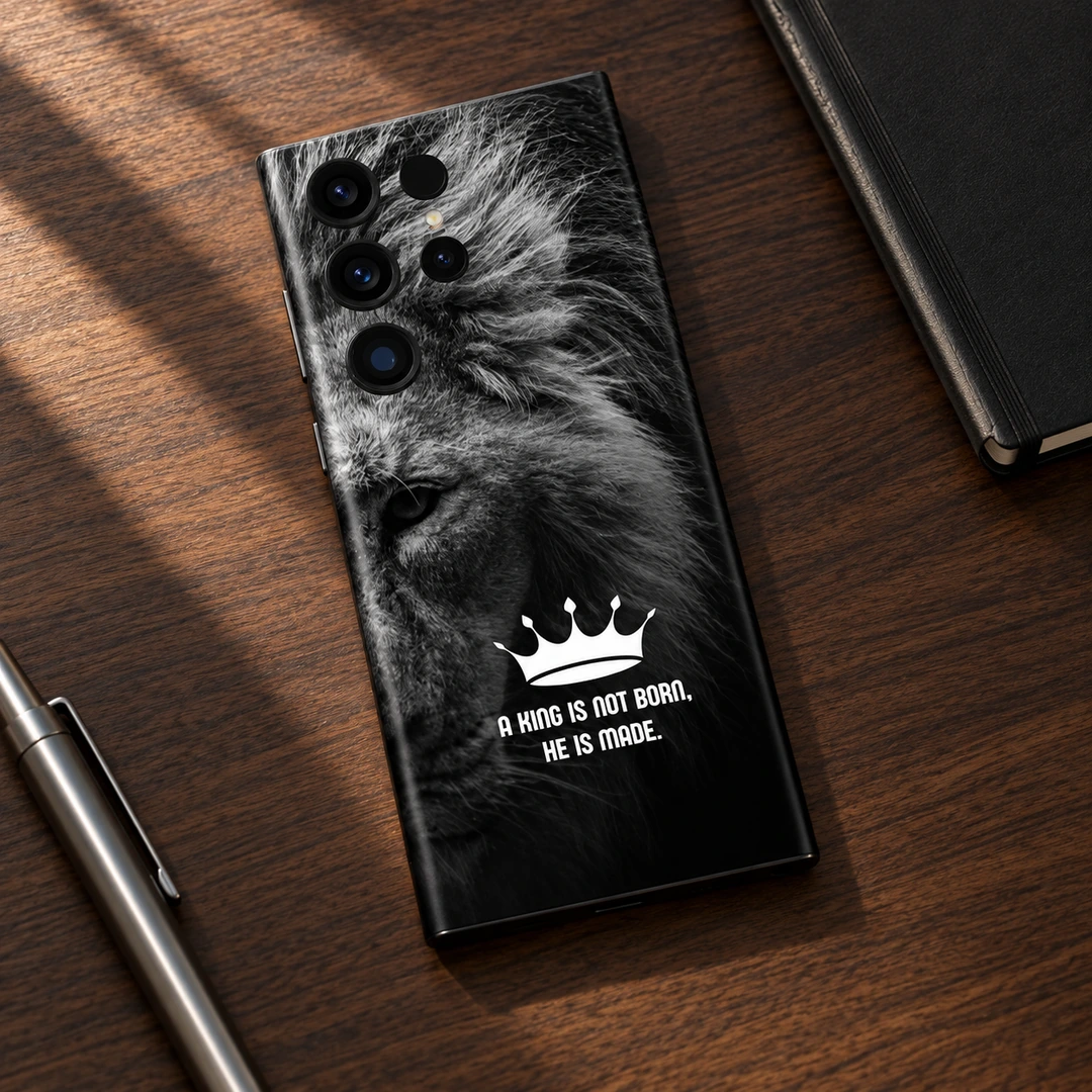 King Lion Motivational Mobile Skin - Walnut Desk Flat Lay King lion motivational mobile skin with crown and quote in walnut desk flat lay