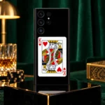 Black King of Hearts card mobile skin with red K symbols, emerald lounge hero