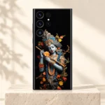 Krishna Colorful mobile skin with blue-grey portrait golden flute and orange flowers on an ivory pedestal
