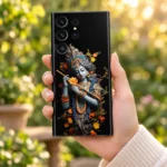Krishna Colorful floral flute mobile skin held in hand in a sunlit garden