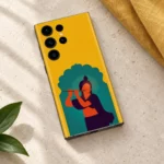 Mustard yellow Krishna mobile skin styled with linen on stone