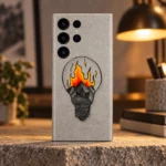 Grey mobile skin with a hand-drawn light bulb containing mountains and orange-yellow illustrated flames, warm lamp editorial