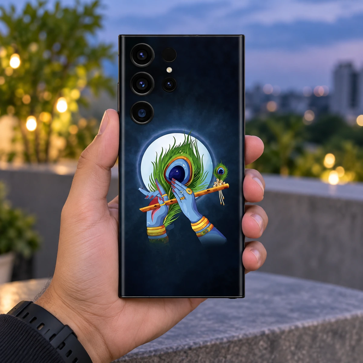 Lord Krishna Peacock Flute Mobile Skin - Evening in-hand Lord Krishna mobile skin with blue hands, flute and peacock feather under a full moon - evening in-hand