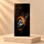 Lord Krishna portrait mobile skin in black and saffron on a pale travertine pedestal