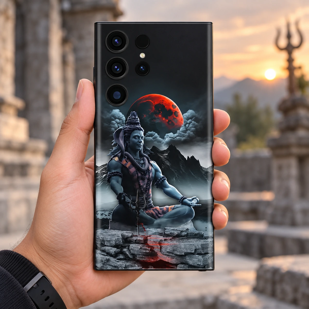 Mahadev Red Moon Mobile Skin - In-hand lifestyle Mahadev mobile skin with Shiva meditating below a red moon - in-hand lifestyle