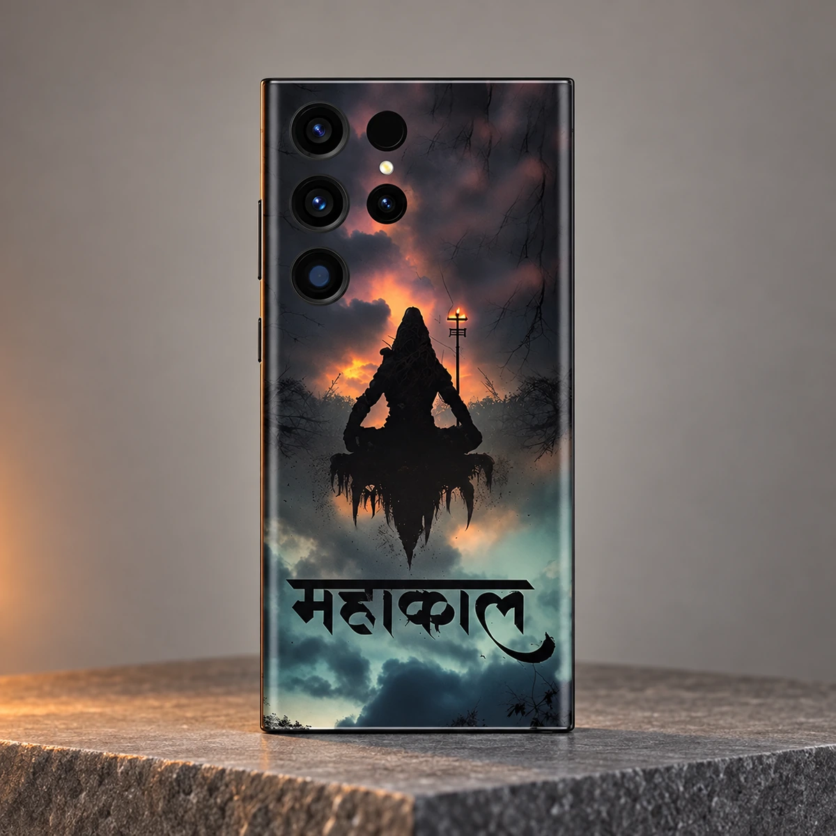 Mahakal Meditation Mobile Skin - hero Mahakal meditation mobile skin with trishul and bold Hindi lettering displayed upright on grey stone