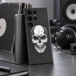 Minimal White Skull Mobile Skin with white skull artwork on charcoal grey, music studio desk