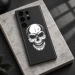 Minimal White Skull Mobile Skin with white skull artwork on charcoal grey, stone slab detail