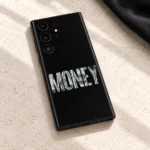 Black Money mobile skin with bold banknote-filled MONEY lettering, limestone detail