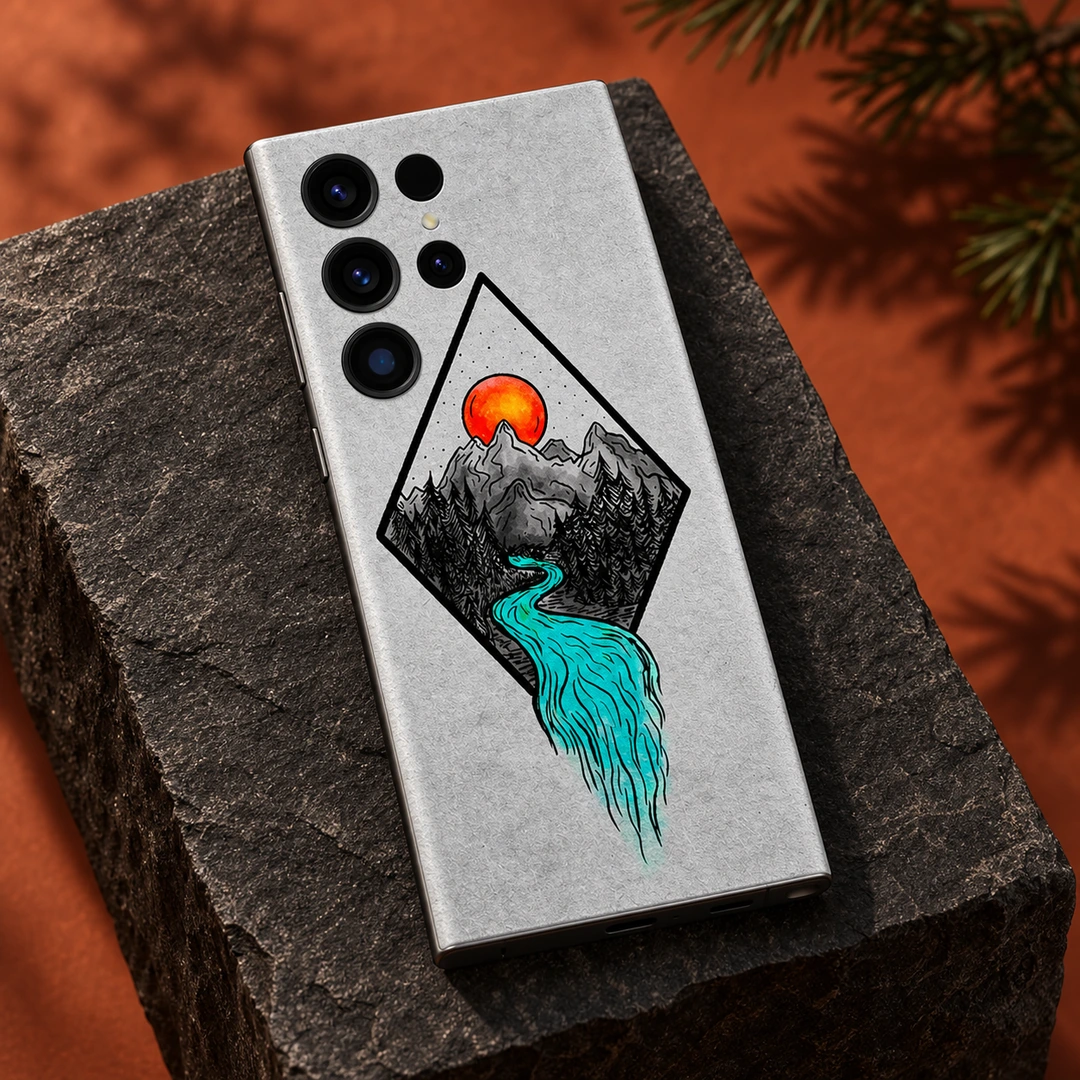 Mountain Art Mobile Skin - Charcoal Plinth Studio View Mountain Art Mobile Skin with orange sun and turquoise river, charcoal plinth studio view