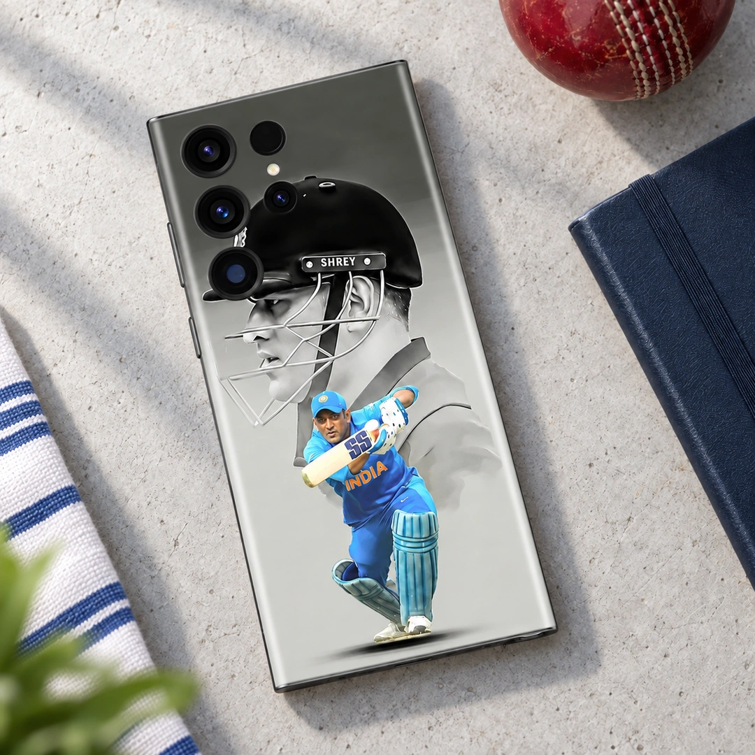 MS Dhoni Photo Mobile Skin - Cricket Desk Flat Lay MS Dhoni Photo Mobile Skin with monochrome helmet portrait and blue batting photo, cricket desk flat lay
