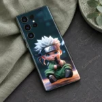 Naruto mobile skin with seated white-haired chibi ninja in green, sage linen flat lay