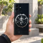 Nataraja silver dance mobile skin held in hand in a daylight courtyard