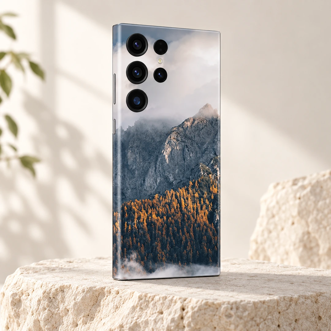 Natural Mountain Autumn Forest Mobile Skin - Limestone studio angle Natural Mountain Autumn Forest Mobile Skin shown at an angle on a pale limestone pedestal