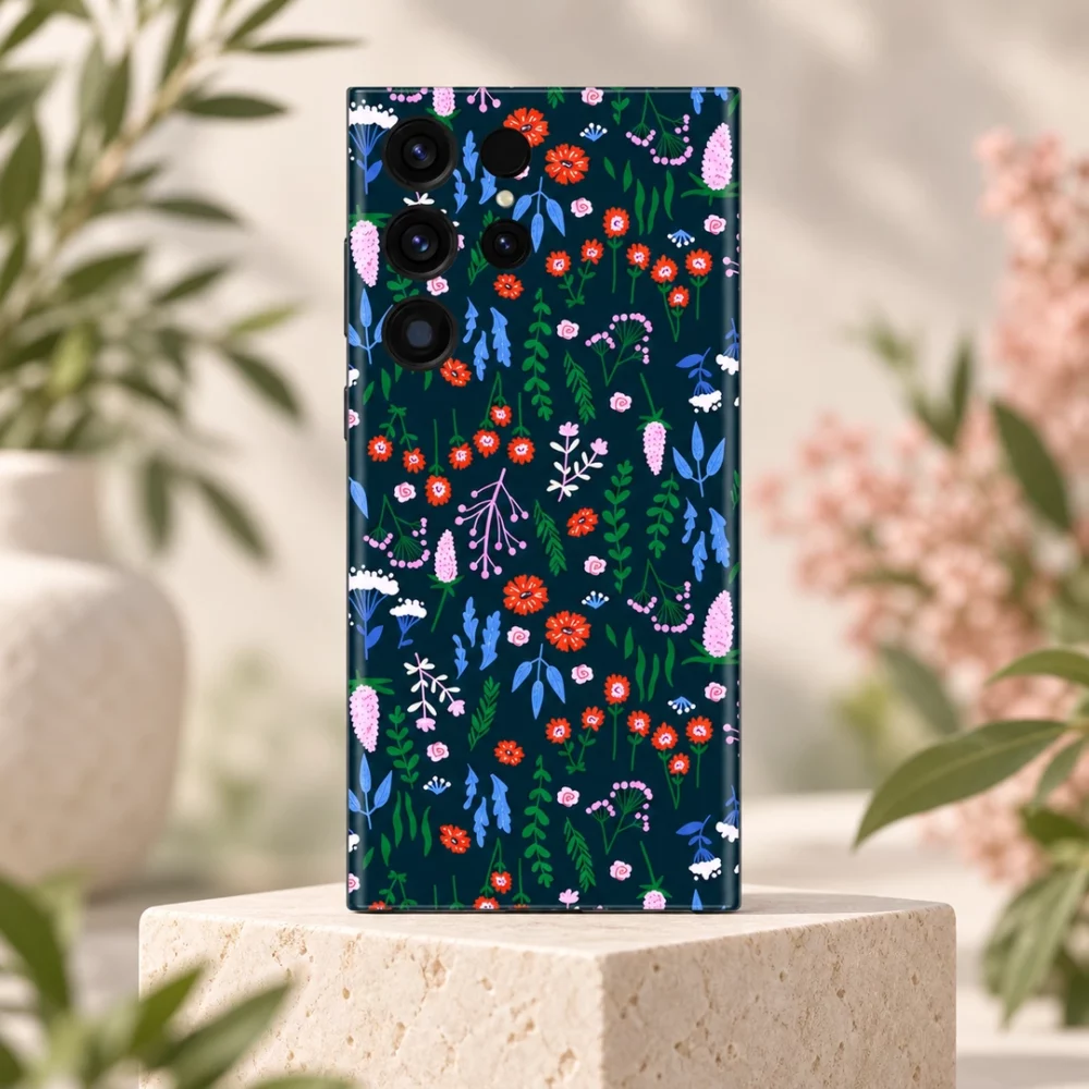 Navy Floral Pattern Mobile Skin shown upright on limestone with soft botanical surroundings