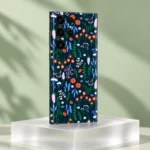 Navy Floral Pattern Mobile Skin shown at an angle on frosted acrylic against sage green