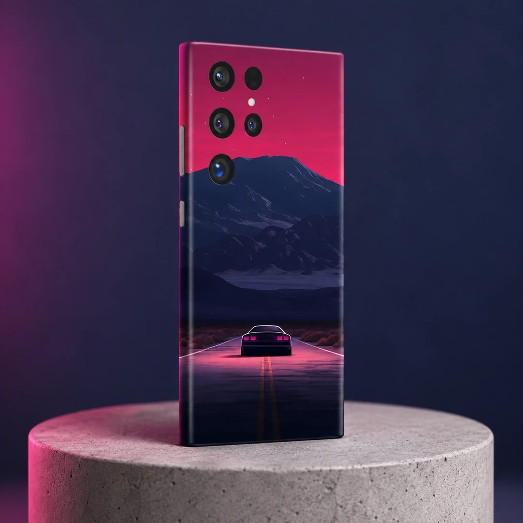 Night Journey Mobile Skin - Concrete Angle Night Journey mobile skin with a car on a pink-lit road beneath navy mountains, concrete angle