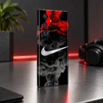 Black phone skin with white swoosh and red and grey smoke, metal desk angle