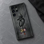 Om With Damru mobile skin with black Om and colourful damru on charcoal - slate flatlay