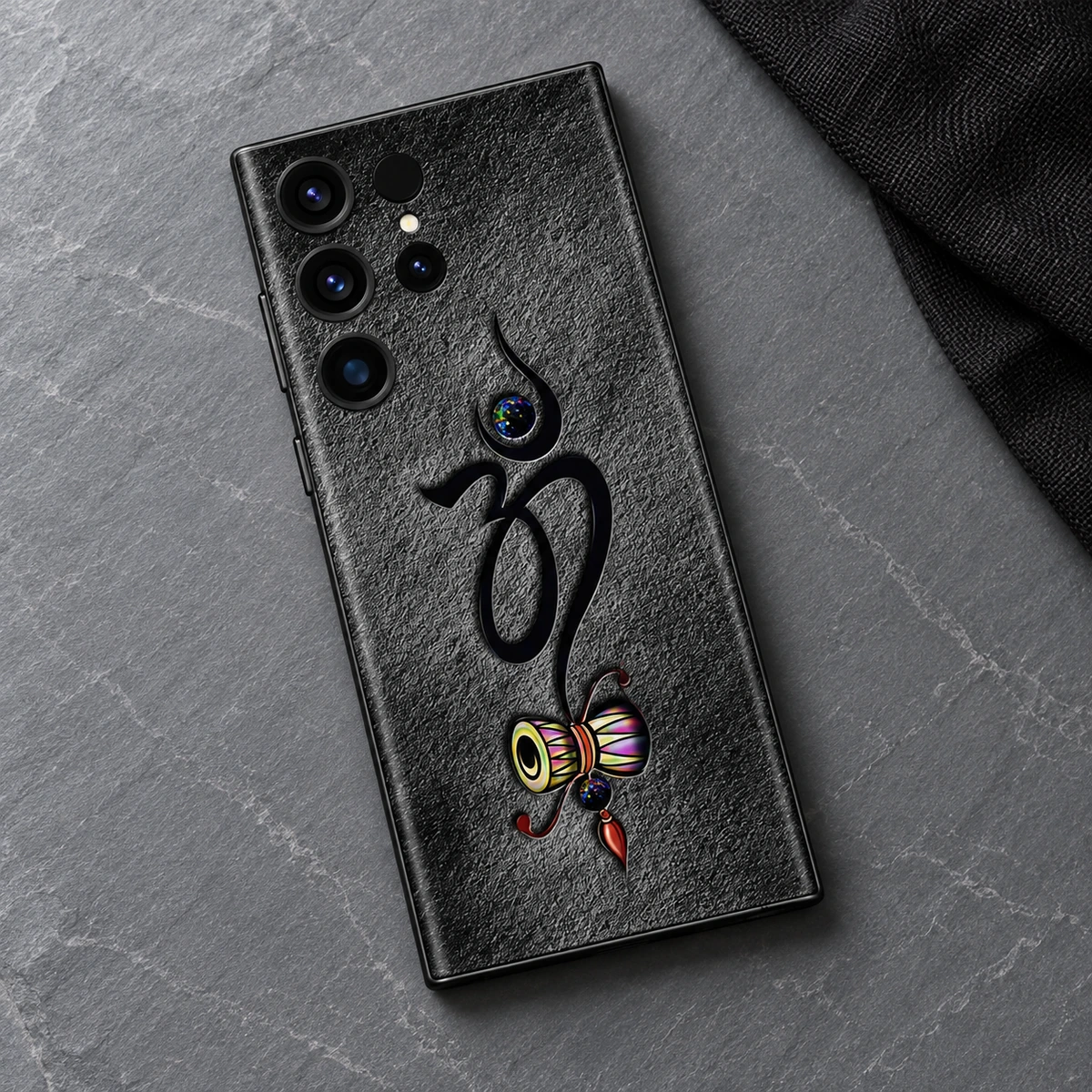 Om Damru Charcoal Mobile Skin - Slate flatlay Om With Damru mobile skin with black Om and colourful damru on charcoal - slate flatlay