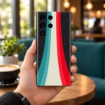 Abstract Design Mobile Skin with teal, ivory and red stripes in cafe handheld view