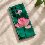 Pink Lotus Flower Mobile Skin shown in linen flat lay