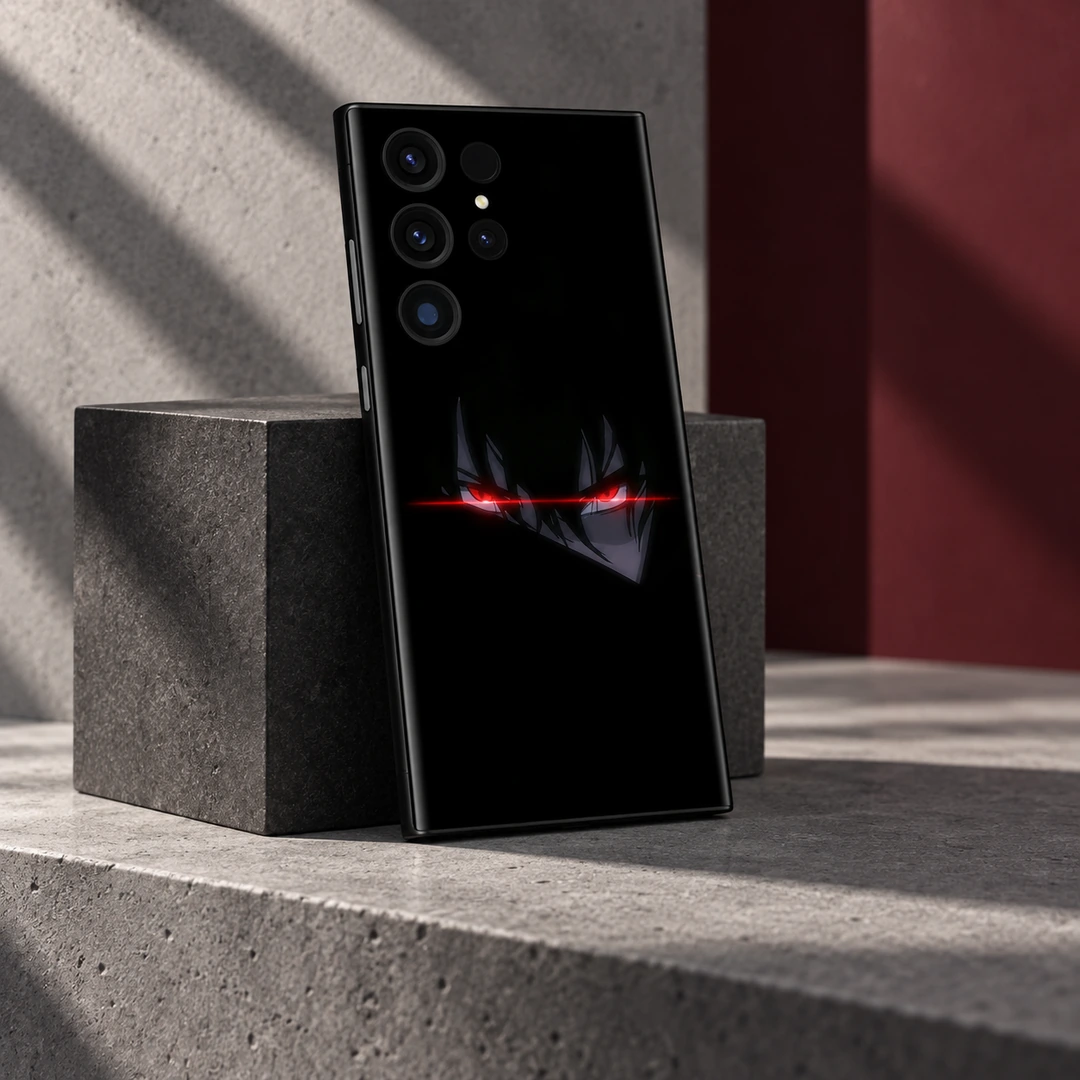 Red Anime Eyes Black Mobile Skin - Concrete studio view Red Anime Eyes Black Mobile Skin shown leaning against a charcoal cube in daylight