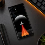Rocket Ship Space Mobile Skin shown diagonally on a dark metal tech desk