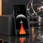 Rocket Ship Space Mobile Skin shown leaning on a graphite block above smoked glass