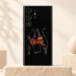Shree Ram Hindu mobile skin with orange calligraphy and grey Ram artwork on black on an ivory pedestal