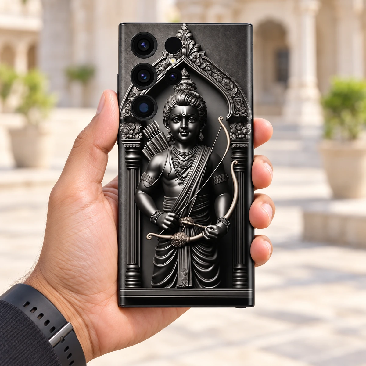 Shree Ram Monochrome Statue Mobile Skin - Daylight handheld Shree Ram Monochrome Statue Mobile Skin held in hand in a bright stone courtyard