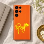Shree Ram calligraphy mobile skin on linen beside a notebook and brass dish
