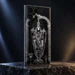 Shree Venkatesh black and silver mobile skin from a rear angle on charcoal granite