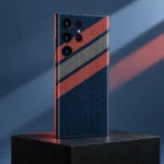 Navy blue mobile skin with coral and grey diagonal stripes and dotted pattern - studio perspective