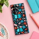 Teal Coral Abstract Doodle Mobile Skin shown in pastel creative flat lay