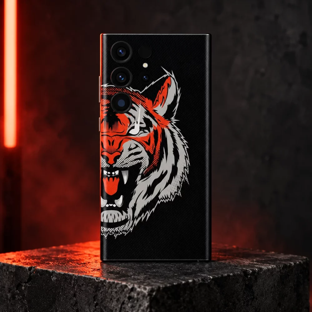 Tiger Face Graphic Mobile Skin shown on a red-lit studio pedestal