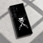 Vendetta Mask Mobile Skin shown in daylight concrete flat lay
