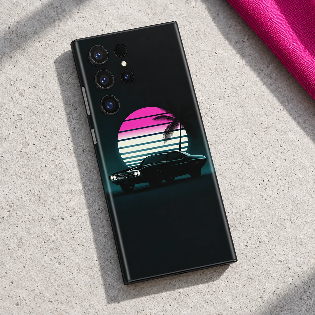 Vintage Car Retro Sunset Mobile Skin – concrete flat lay Black vintage car mobile skin with pink striped sunset and palm artwork, concrete flat lay
