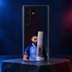 Virat Kohli mobile skin showing his blue-jersey portrait behind an upright bat, blue and crimson studio hero