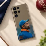 Virat Kohli mobile skin with blue cap portrait and VIRAT lettering in daylight flat lay view