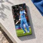 Virat Kohli Blue India Celebration Mobile Skin, stone bench view with raised gloved fist and cricket bat