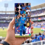 Virat Kohli Photo Mobile Skin with raised bat and blue India jersey, stadium lifestyle