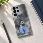 Virat Kohli smoky grey portrait mobile skin with blue jersey in concrete desk flat lay setting