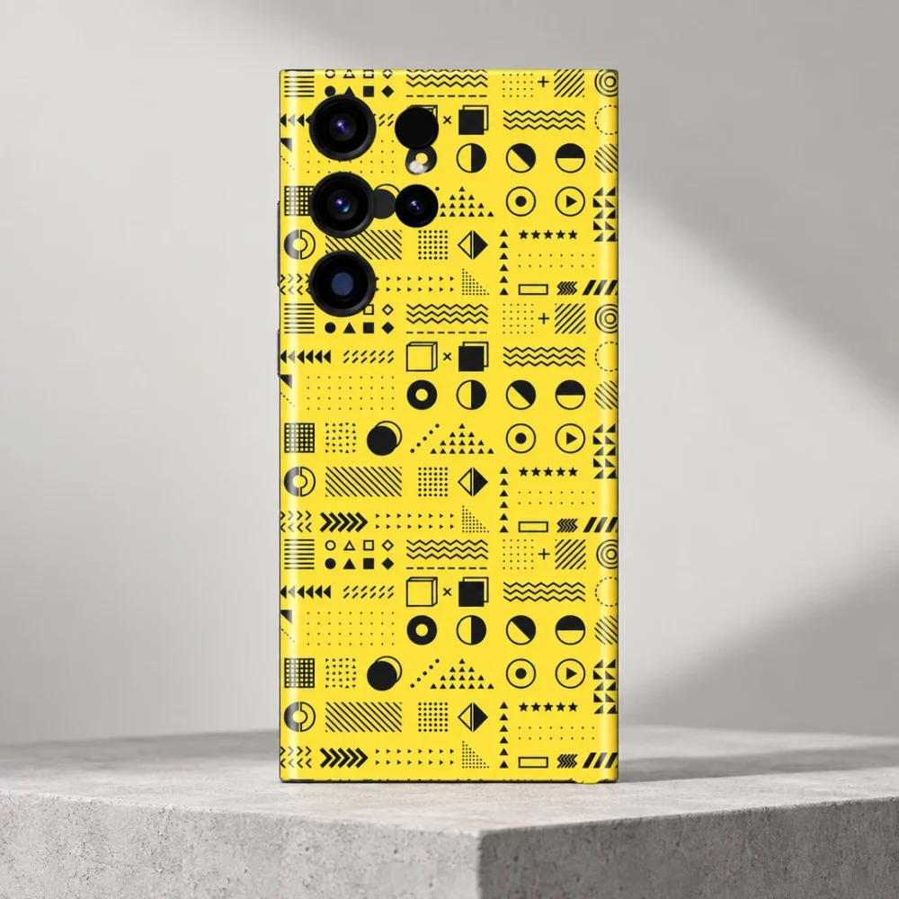Yellow geometric pattern mobile skin on a grey studio plinth