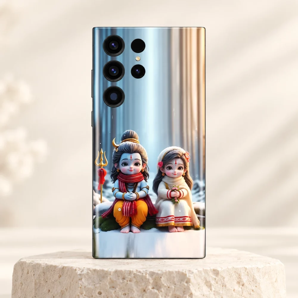 Cute Mahadev with Parvatiji winter mobile skin with blue Shiva and white-clad Parvati on an ivory pedestal
