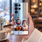 Cute Mahadev Parvati winter mobile skin held in hand in a cozy cafe