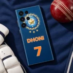 Blue Dhoni 7 mobile skin with orange lettering and gold cricket crest, cricket kit flat lay