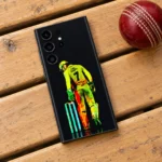 Dhoni mobile skin with yellow number 7 wicketkeeper artwork on black, clubhouse bench flat lay